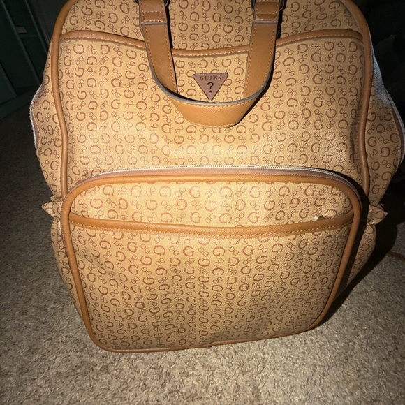 Guess Handbags - Stunning Guess Manhattan Monogram Backpack - Send Offers